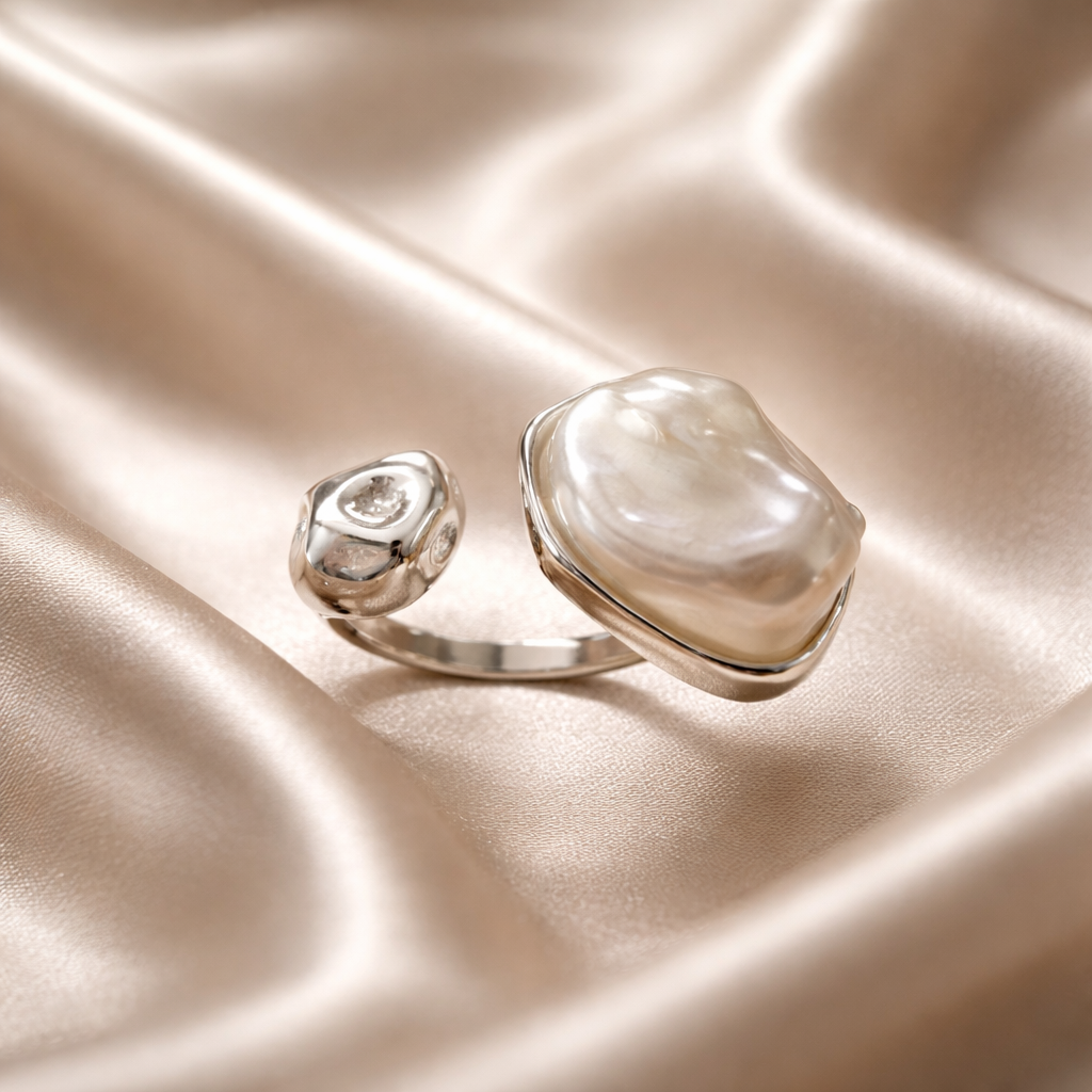 Anillo de acero con perla