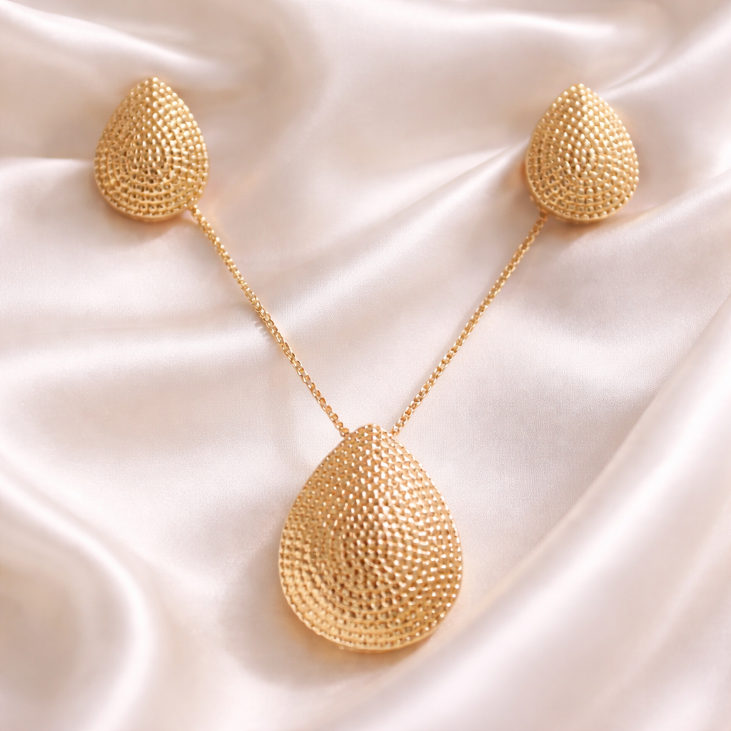 Conjunto de Acero  bañado en oro 18